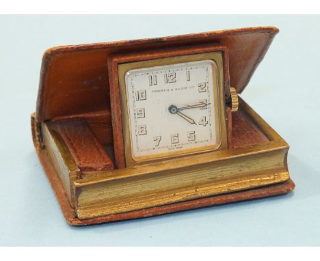 Livre d'Heures, a travelling clock in the form of a small book, the clock face springing up when the front cover opens, retai