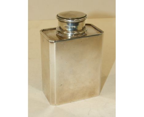 A Tiffany & Co. rectangular tea caddy with chamfered corners, sliding top and circular removable lid, 12cm high, London 1937,