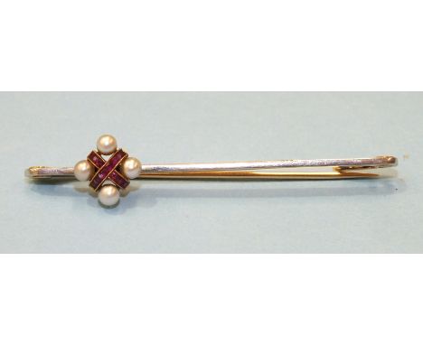 An unmarked gold bar brooch with a ruby set 'X' and four pearl cluster, 5.5cm, 4g.