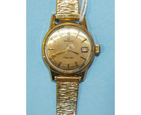 Omega, a ladies Seamaster Ladymatic gold-plated wrist watch with circular dial, baton numerals and date aperture, on plated b