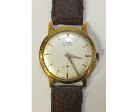 Roamer, a gentleman's 14k-gold-cased Incabloc wrist watch the silvered dial with baton numerals and seconds subsidiary, on le