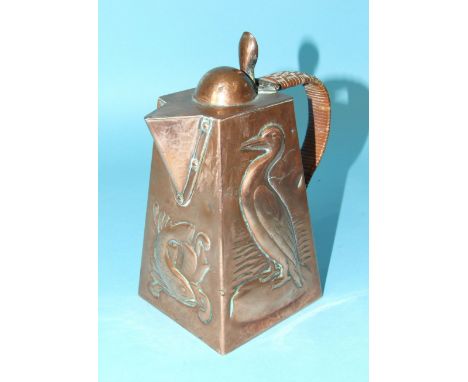 A Newlyn copper square tapered jug, relief decorated with a pair of cormorants, on either side and a fish under the spout, th