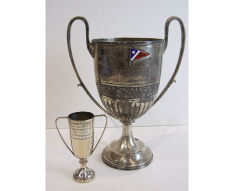 A silver trophy cup of inverted campana form with twin loop handles and inscription "Presented by N.M.B.C.", 23.5cm high, She