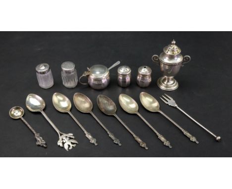 A silver two handled classical vase shape pepperette, London 1912, 8cm high, a small three piece silver cruet, Birmingham 193