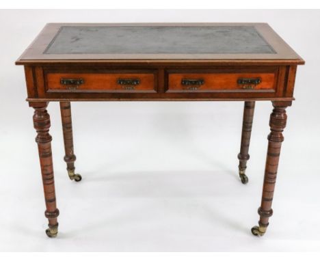 An Edwardian walnut writing table, the moulded rectangular inset top above two frieze drawers, stamped James Winter &amp; Son
