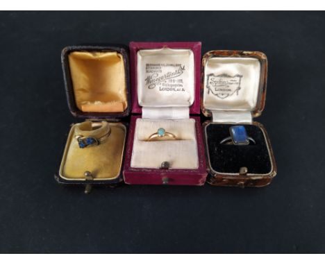 An unmarked yellow metal band ring with later added small opal stone, weight approx 1.5g plus two other rings, all boxed