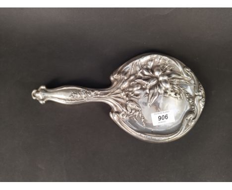 An antique silver hand mirror with floral decoration, hallmarked Chester 1911