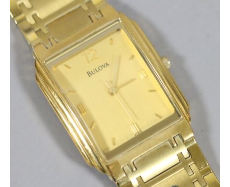 A gentlemens Bulova quartz wristwatch with oblong face and baton markers.