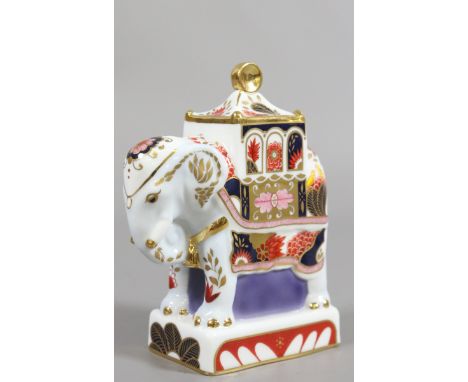 A boxed Royal Worcester candle snuffer formed as the Nelson elephant.