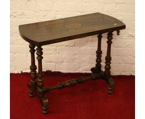 A Victorian inlaid walnut side table raised on turned supports.