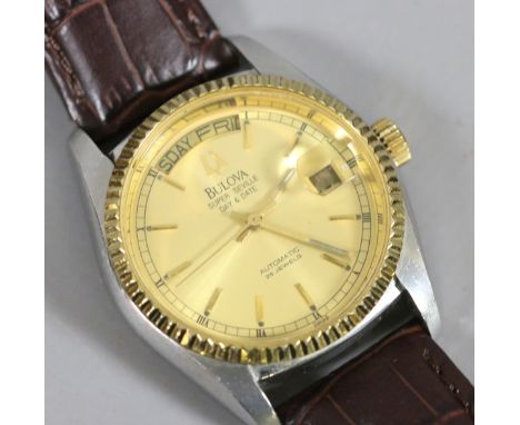 A gentlemens Bulova Super Seville automatic wristwatch with day and date chapters and baton markers and with exhibition back.
