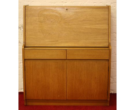 A G-plan style light oak fall front bureau.