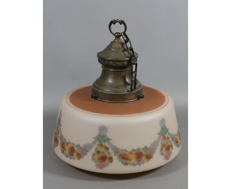 An antique opaque glass ceiling light shade with copper fitting decorated with fruit and flower pattern.
