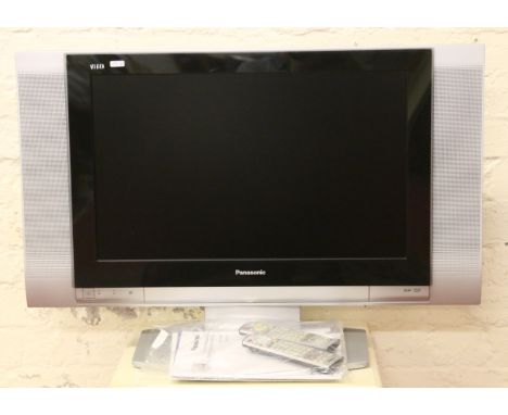 A Panasonic 26" flat screen television, remote control and instruction manual.