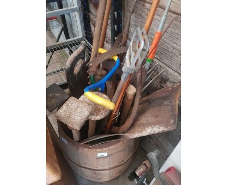 Wooden barrel of gardening tools