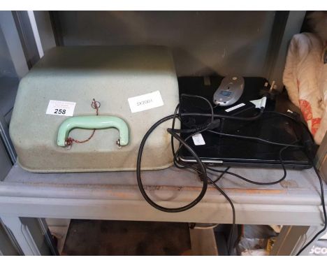 Cased typewriter &amp; a laptop