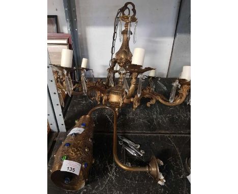 A brass &amp; bead light fitting and a chandelier 