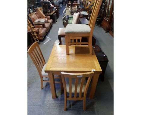 Light oak extending dining table along with 4 chairs