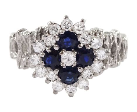 White gold sapphire and round brilliant cut diamond cluster ring, with pierced design shoulders, stamped 18ct, total diamond 