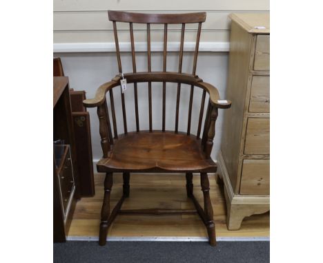 An early 20th century mahogany Windsor comb back armchair, width 64cm, depth 38cm, height 103cm