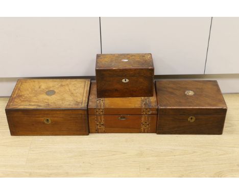 Three Victorian writing boxes and a tea caddy, largest 35cm wide, 15cm high, 24cm deep