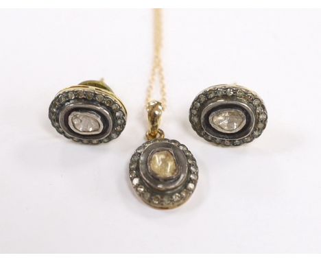 A suite of Indian yellow metal and diamond cluster set suite of jewellery, comprising an oval pendant (overall 22mm), on a 14