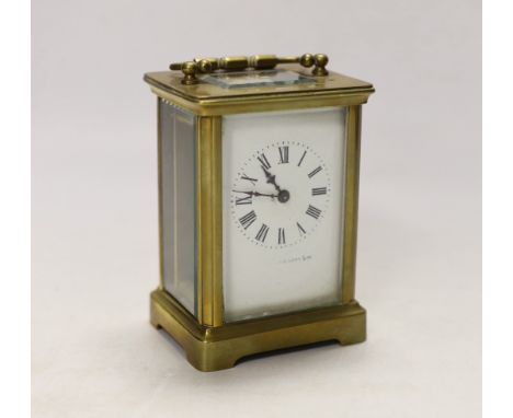 An early 20th century French lacquered brass carriage clock, cased