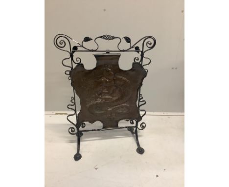 An Edwardian embossed copper and wrought iron fire screen, height 79cm