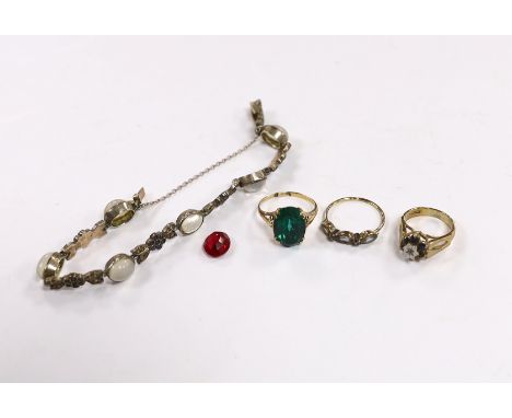 Two 9ct and gem set rings, one other costume ring, an unmounted oval cut synthetic ruby and  a moonstone and paste set white 