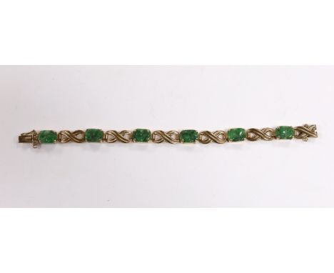 A 9ct gold and six stone carved jade panel set bracelet, 17cm, gross weight 15.2 grams.