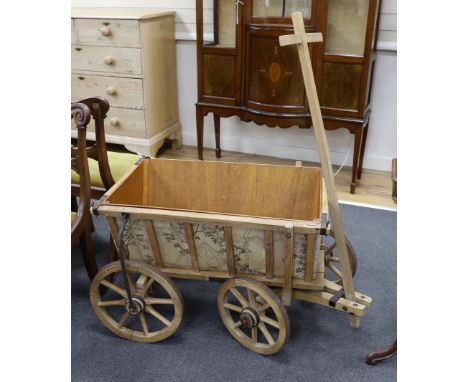 A vintage oak dog cart with later liner, length 78cm, depth 55cm, height 55cm