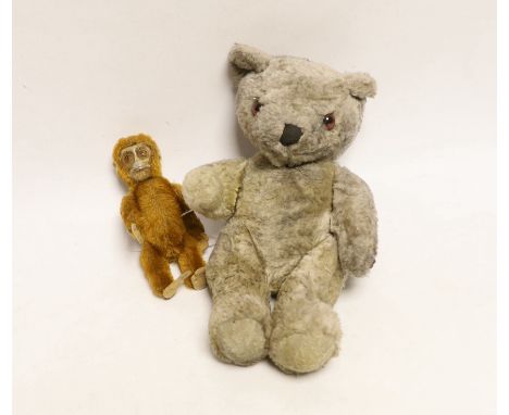 A Schuco vintage perfume bottle in the form of a Monkey and another novelty teddy bear perfume bottle, largest 22cm in length