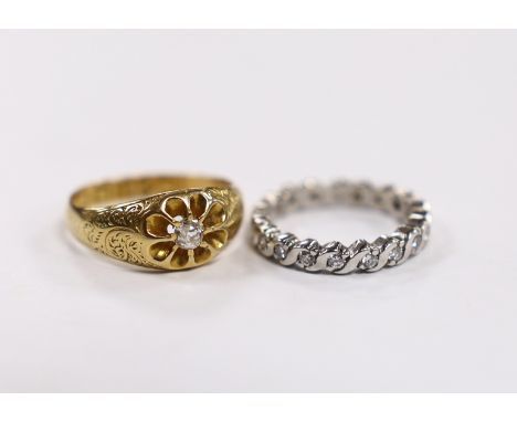 An early 20th century 18ct gold and claw set solitaire diamond ring, size M, gross 3.8 grams and a modern platinum and diamon