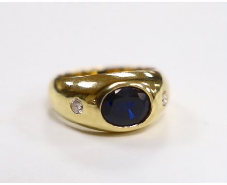 A 750 yellow metal, synthetic sapphire? and two stone simulated diamond gypsy set ring, size K, gross weight 7.8 grams.