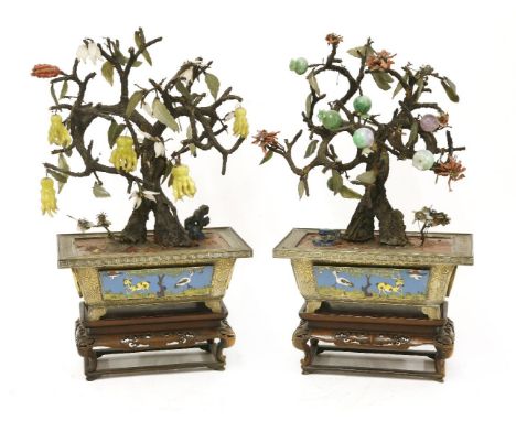 A pair of Chinese ornamental bonsai trees,Republic period (1912-1949), each brass planter decorated with cloisonné cranes and