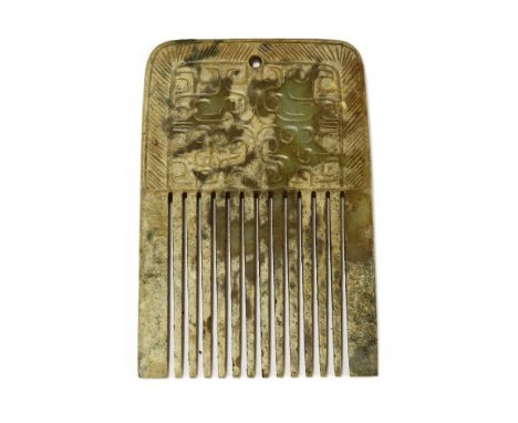 A Chinese jade comb,engraved with archaic scrolls surrounded by a border with symmetrical lines,8.4cm long仿古玉梳