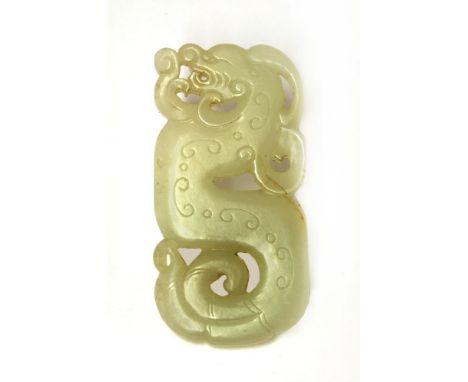 A Chinese jade plaque,Qing dynasty (1644-1911), in the shape of a dragon with engraved archaic scrolls, the stone of white to