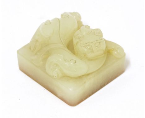 A Chinese jade seal,Qing dynasty (1644-1911), carved with a chilong lying on a square plinth engraved with 'Tian Lang Qi Qing