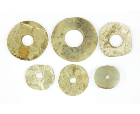 A group of Chinese jade bi disc,Neolithic period, Qijia Culture (2200 - 1600 BC), of typical form, plain,5.6 to 10.7cm (6)Pro