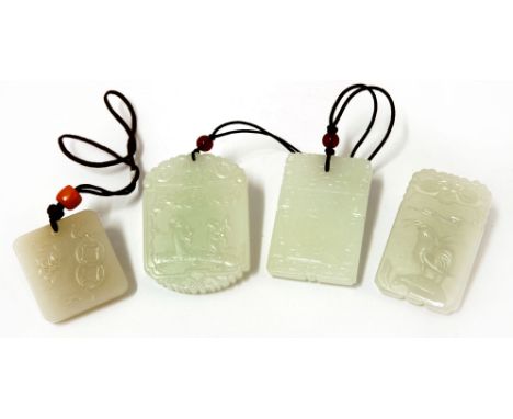 Four Chinese jade pendants, 20th century, of rectangular form, one carved with a cockerel, one with quail and millet, one wit