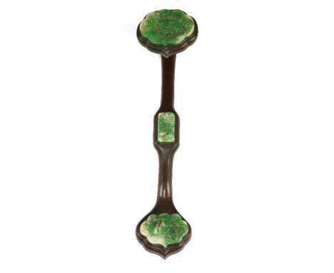A Chinese wood ruyi sceptre, of typical form, inserted with three jade pieces carved with carps leaping over Dragon's Gate in