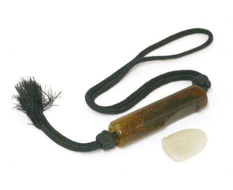 A Chinese hardstone toggle, Qing dynasty (1644-1911), of cylindrical form, 7.5cm long, and a white jade carving of a cicada, 