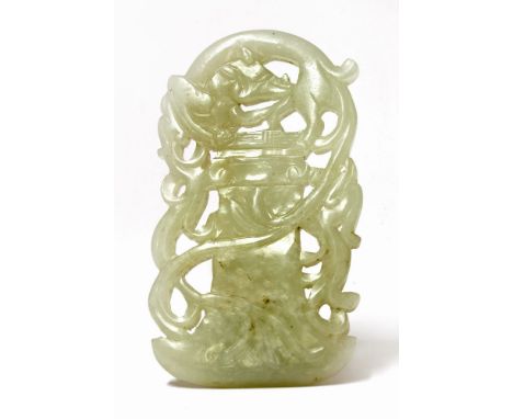 A Chinese jade plaque,early Qing dynasty, pierced and carved with a chilong over an archaic axe, two other chilong alongside,