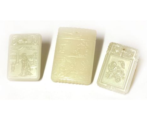 Three Chinese white jade plaques, 20th century, of rectangular form, each engraved with an inscription to one side, the other