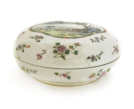 A Chinese famille rose box and cover,Guangxu (1875-1908), of circular form, painted with a literatus under an umbrella watchi