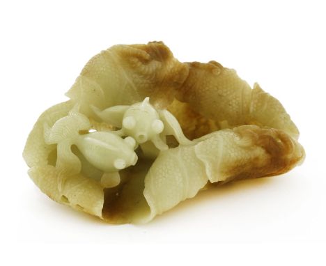 A Chinese jade carving, of two goldfish above a lotus leaf, the stone of pale green tone, 16.5cm long