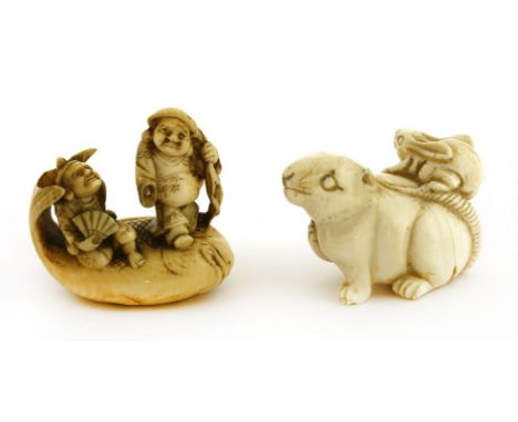 Two Japanese ivory netsuke, c.1920, one with Daikokuten and Ebisu on the back of a carp, signed Mitsumasa, 4cm high, and anot