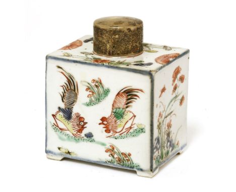 A Chinese wucai tea caddy,Kangxi (1662-1722), of rectangular form on four feet, painted with cockfights and flowers, metal co