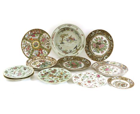 A Chinese famille rose basin, late Qing dynasty, painted with boys at play in a garden, the rim with florets, 27.7cm diameter