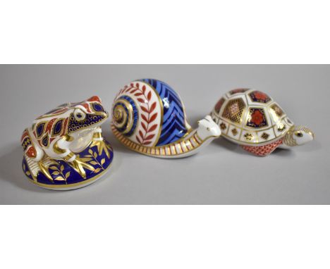 A Collection of Three Royal Crown Derby Paperweights to Include Frog, Snail and Tortoise, Two with Ceramic Buttons One withou